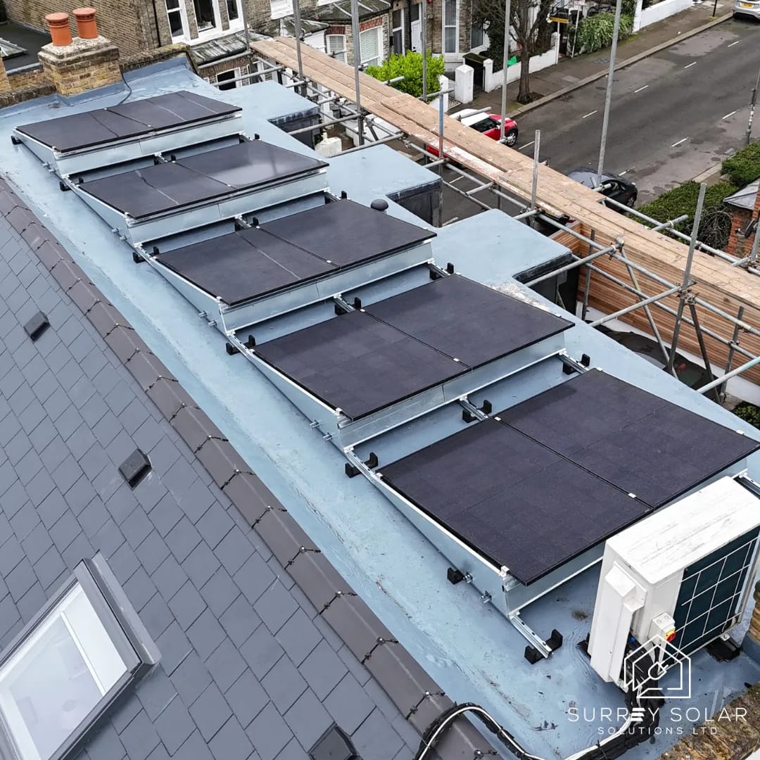 Aerial view of a flat-roof solar installation