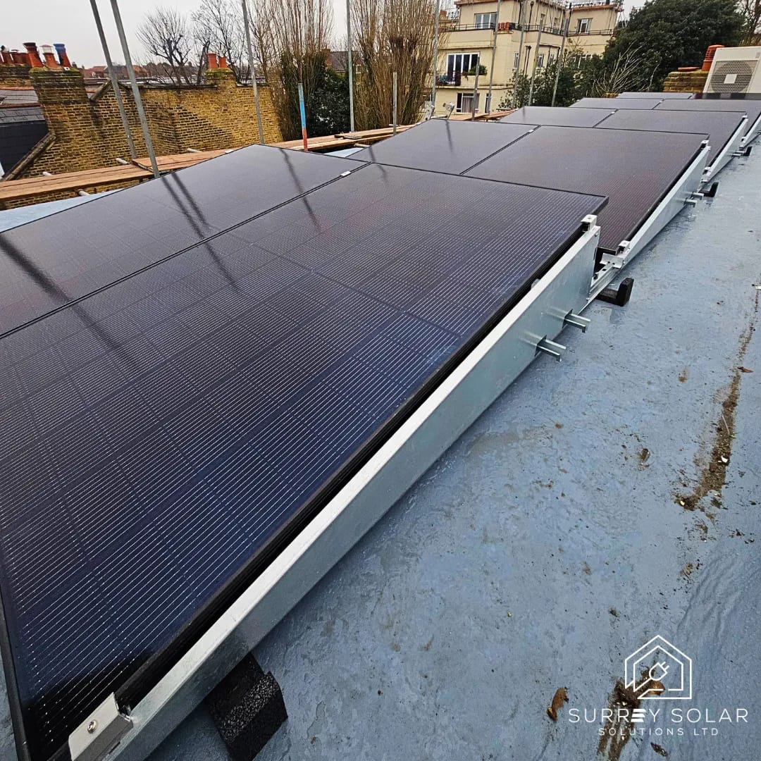 Row of solar panels mounted on a flat roof