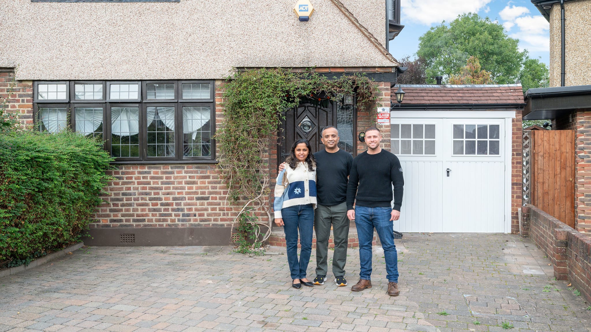 The Grand Innovations team outside a completed project