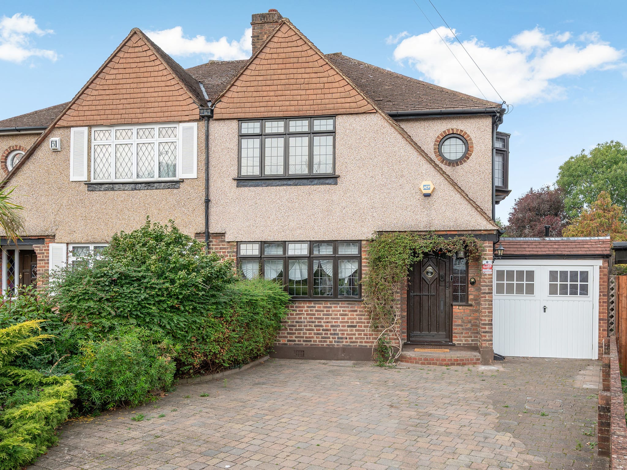 Garage conversion blended into the home's frontage, Epsom