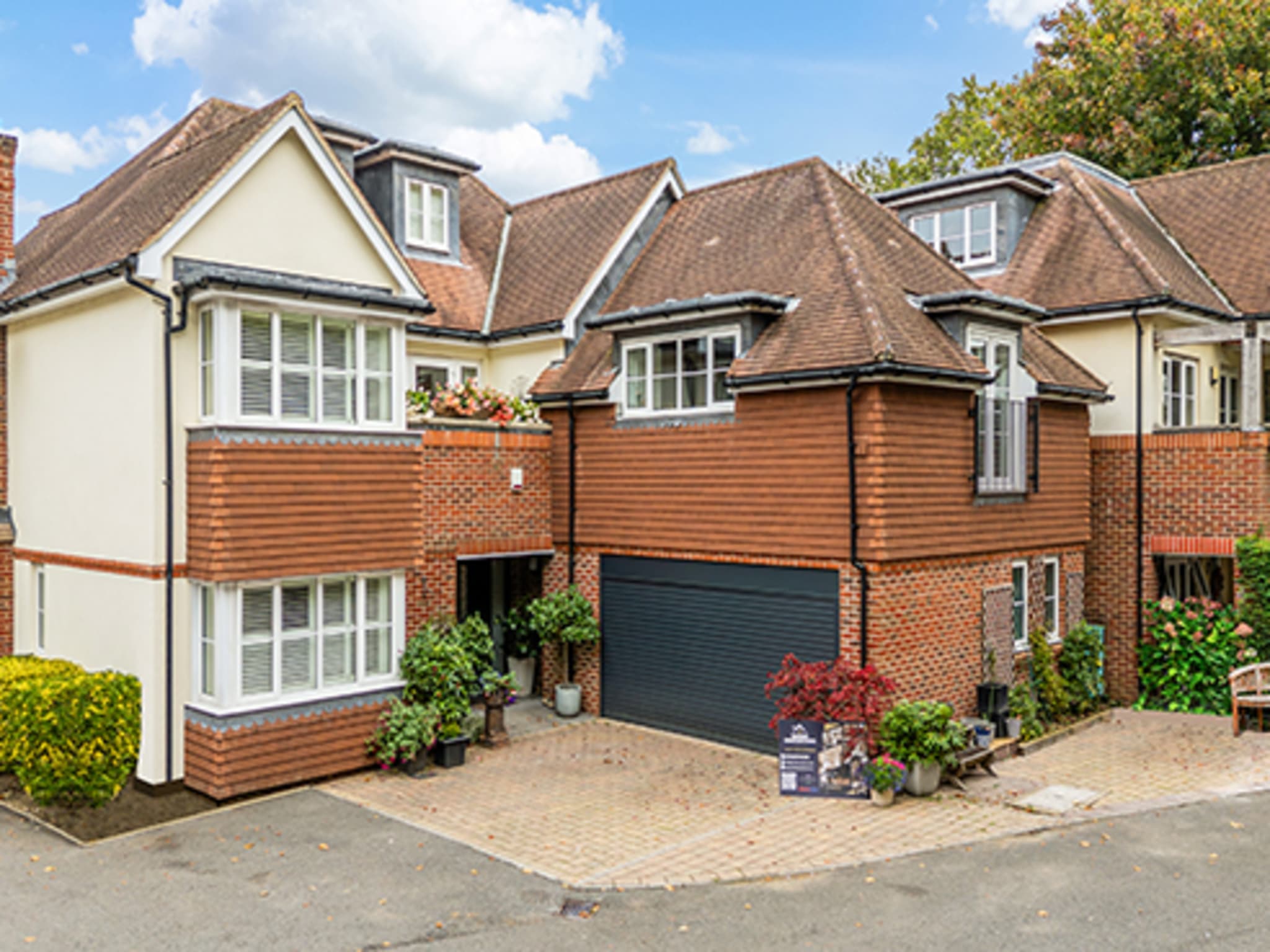 Aerial view of completed home extension and grounds
