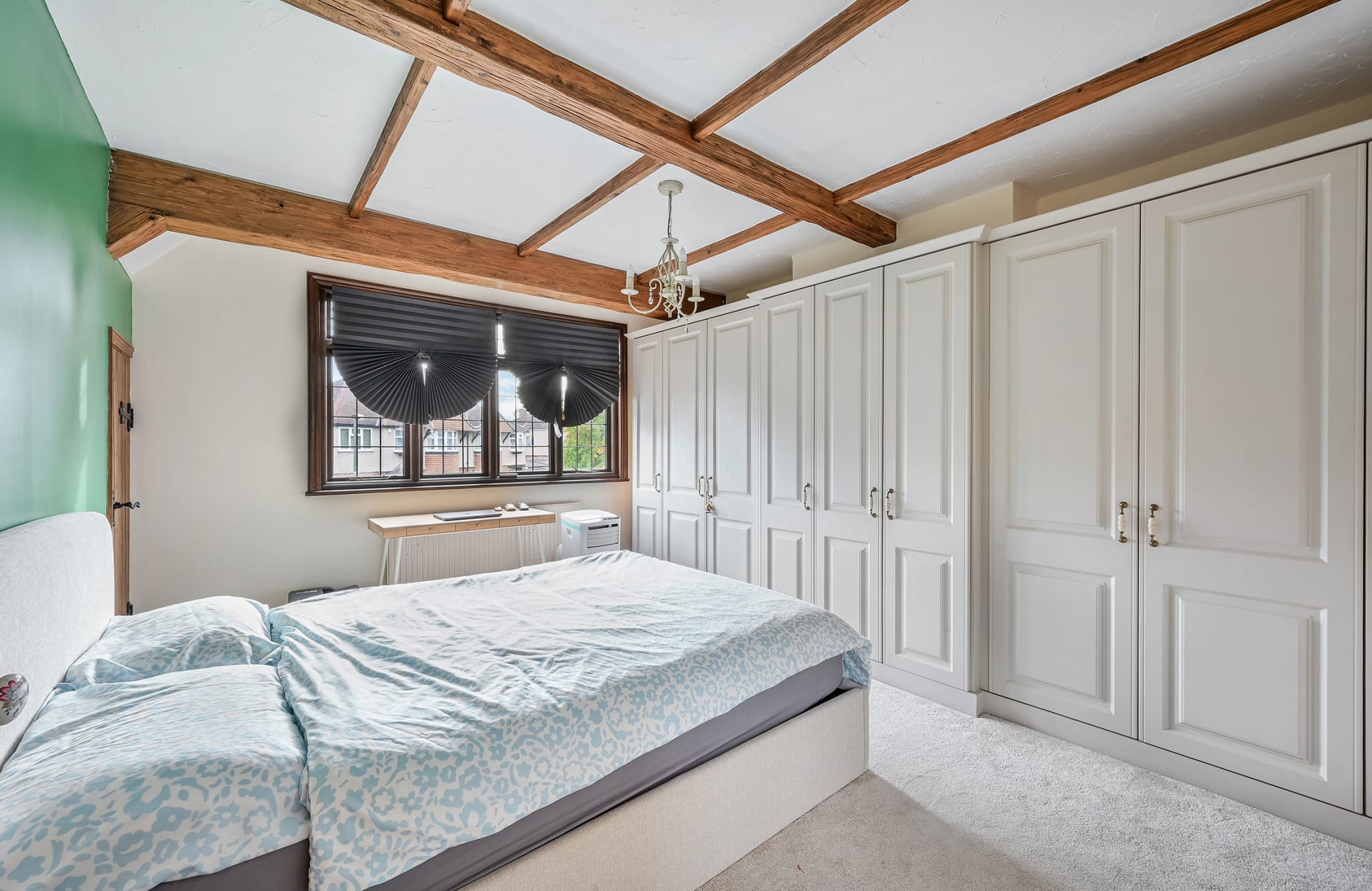 Cost to build room above garage UK: Epsom master bedroom guide